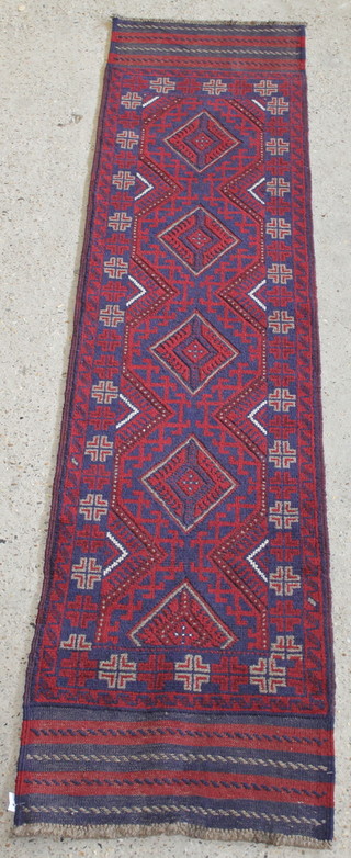 A red and blue ground Meshwani runner with 5 diamonds to the centre 100" x 24" 