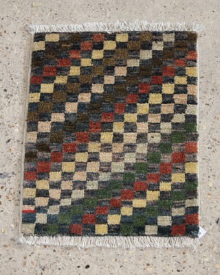 A Ghazni wool Chobi rug formed of squares 23" x 16 1/2" 