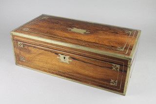 A 19th Century rectangular rosewood and brass banded writing slope with hinged lid and fitted interior 6 1/2"h x 19 1/2"w x 10"d