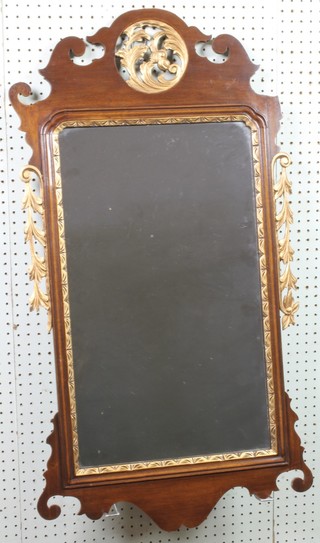 A bevelled plate Chippendale style mirror contained in a mahogany frame 37 1/2"h x 26"  