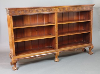 An Edwardian Chippendale style mahogany open bookcase with blind fret work frieze, fitted adjustable shelves, raised on cabriole, ball and claw supports 46"h x 75"w x 13 1/2"d