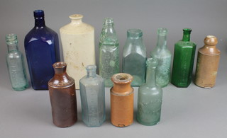 A collection of glass and stoneware bottles 