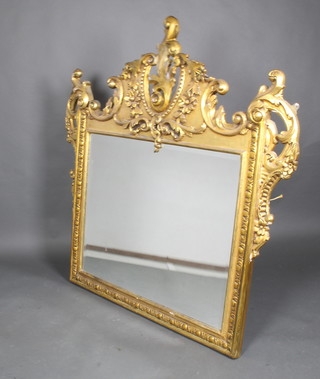 A Victorian square plate over mantel mirror contained in a decorative plaster and carved gilt frame 60"h x 57"w 