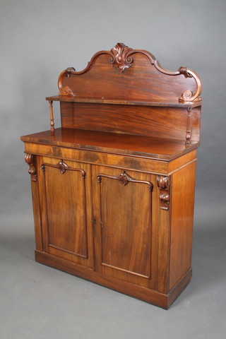 A Victorian mahogany chiffonier with raised shelved back, the base fitted a cupboard with scrolls to the side 63"h x 45"w x 17"d 