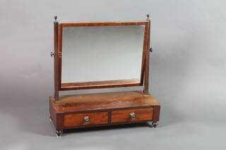 A rectangular Georgian plate toilet mirror contained in a crossbanded and inlaid mahogany swing frame, the base fitted 2 drawers, raised on turned supports 24"h x 23"w x 9"d 