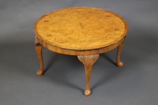 A 1930's Queen Anne style circular figured walnut occasional table with pie crust decoration, raised on pillar supports 17"h x 39 1/2"diam.  