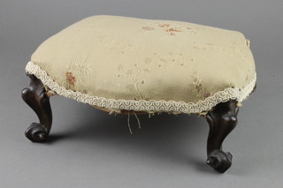 A Victorian mahogany footstool of serpentine outline, raised on cabriole supports 5"h x 13"w x 11"d 
