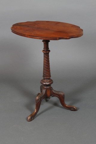 A Victorian oval shaped mahogany wine table raised on a tapering column and tripod base 28"h x 24"w x 17 1/2"d

