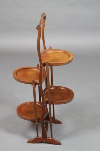 A mahogany 4 tier folding cake stand 34"h x 16"w x 10"d