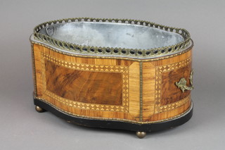 An Empire style walnut and crossbanded jardiniere of serpentine outline with brass gallery, gilt metal mounts throughout, raised on bun feet complete with zinc liner, 6 1/2"h x 14"w x 10"d 