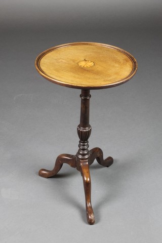 An Edwardian inlaid mahogany wine table, raised on pillar and tripod base 19"h x 12" diam.