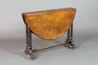 A Victorian oval walnut drop flap Sutherland table, raised on turned supports 27"h x 36"l x 6"w when closed by 40" when open 