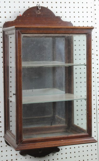 An Edwardian mahogany wall mounting glazed and mirrored back "confectionary" cabinet of rectangular form 23"h x 11 1/2"w x 8"d 