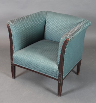 A Victorian ebonised show frame armchair upholstered in blue material on square tapering supports