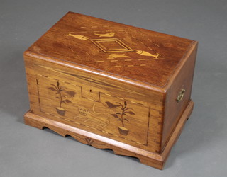 An inlaid camphor trunk with hinged lid, the lid inlaid diamond, fish and bird motif, the front decorated a lion, plants and birds, having brass drop handles to the sides 15"h x 24"w x 15"d 