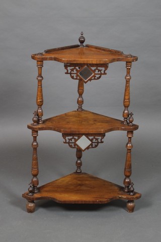 A late Victorian walnut triangular 3 tier corner what-not, raised on turned supports 35"h x 14"w (at widest) x 24"d (at deepest)