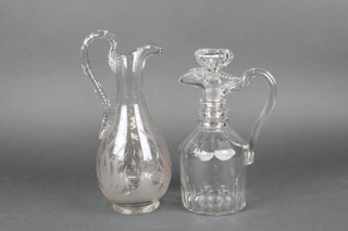 A 19th Century pear shaped ewer, the engraved decoration with flowers and birds 12", a ditto faceted mallet decanter and stopper 10"  