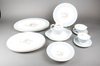 A Royal Doulton Rose Elegans dinner and coffee service comprising 12, 2 handled cups, 5 tea cups, 18 saucers, 19 sandwich plates, 16 medium plates, 12 dinner plates, a milk jug, 6 dessert bowls, 2 cake plates and 4 oval meat plates