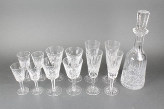 A suite of Waterford crystal comprising a mallet shaped decanter, 4 sherries, 4 wines and 4 champagnes