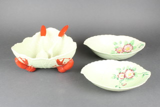 A Carltonware salad bowl with lobster feet and servers, 2 ditto leaf shaped dishes 