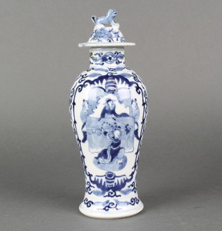 A Chinese baluster blue and white vase decorated with panels of figures on a ground of flowers with 4 character mark 9" 