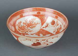 A late 19th Century Japanese bowl decorated with figures in a garden landscape and panels of flowers 10" 