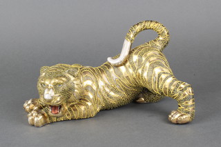 An early 20th Century Japanese Satsuma figure of a crouching tiger, signed 10" 