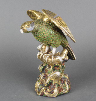 An early 20th Century Japanese Satsuma figure of an eagle on a rocky outcrop, signed 11"  