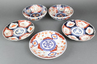 A pair of Imari bowls decorated with panels of garden landscapes and flowers 8", 3 Imari plates