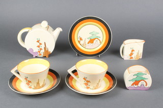 An Art Deco Clarice Cliff style 8 piece tea set decorated with stylised red roofed cottages