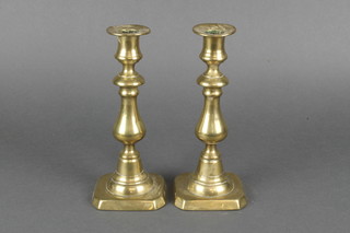 A pair of 18th/19th Century brass candlesticks with ejectors 8" 