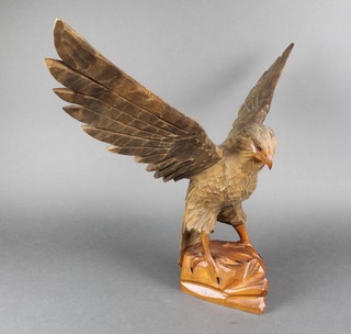 A Continental carved hardwood figure of an eagle with wings outstretched