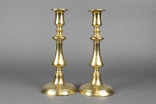 A pair of 18th/19th Century brass candlesticks 10"