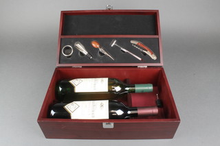 A bottle of 2003 Chateau Sables Peytraud Bordeaux and a bottle of 2005 Bordeaux Sauvignon in a presentation case, containing a corkscrew, thermometer and other wine implements