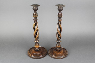 A pair of 1930's spiral turned oak candlesticks with metal sconces 14" 