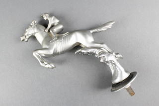 An Art Deco chrome car mascot in the form of a jumping horse with jockey, marked Desmo 