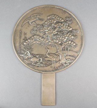 A Japanese bronze hand mirror decorated with stork beneath trees, signed 9 1/2" 