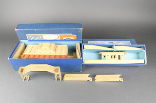 A Hornby Dublo D1 island platform, ditto through station, a foot bridge and a Hornby Dublo 2 rail handle 