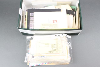 A shoe box containing various envelopes, loose stamps etc 