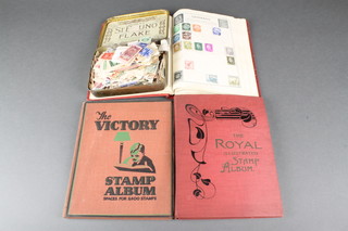 2 Victory stamp albums, a Royal stamp album, a tin of loose stamps