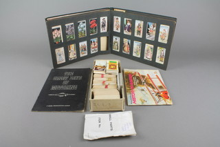 An album of cigarette cards together with an album of tea cards and loose cigarette cards