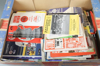 A collection of football match programmes including Chelsea, Manchester United and others 