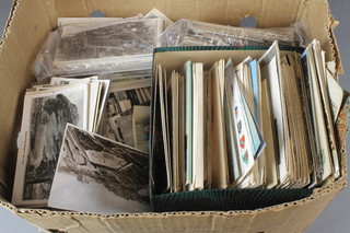 A box containing various postcards