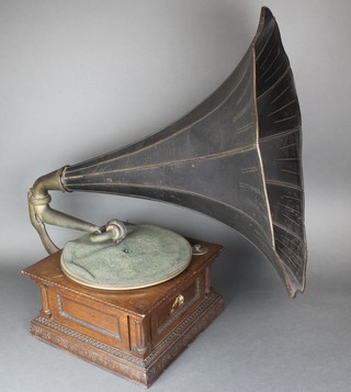An early 20th century oak HMV gramophone with horn together with a collection of records 