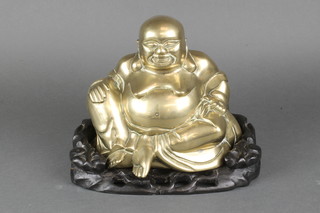 A gilt metal figure of a seated Buddha 8" 