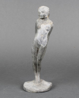 A lead figure of a standing lady raised on an arch shaped base 9" 