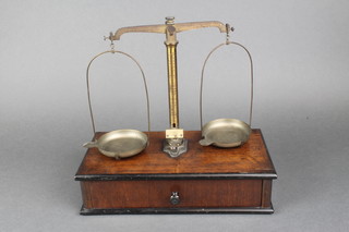 A pair of 19th Century mahogany brass scales complete with weights