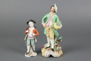 A Staffordshire style figure of young man carrying a basket of flowers 8", an Italian figure of a boy with crossbow 5"  