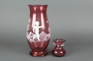 A Victorian Mary Gregory style vase, the cranberry body decorated with a boy chasing a bird 10", a Victorian cranberry wavy neck vase 3" 