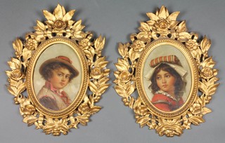 Italian School, a pair of 19th Century oval oil on canvas portraits, studies of a boy and girl, contained in pierced floral gilt frames, indistinctly signed  9" x 6 1/2" 
